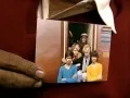 Return Trip: man holding original photo in India
